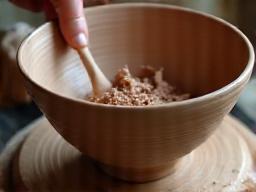 Trimming the base of a ceramic bowl